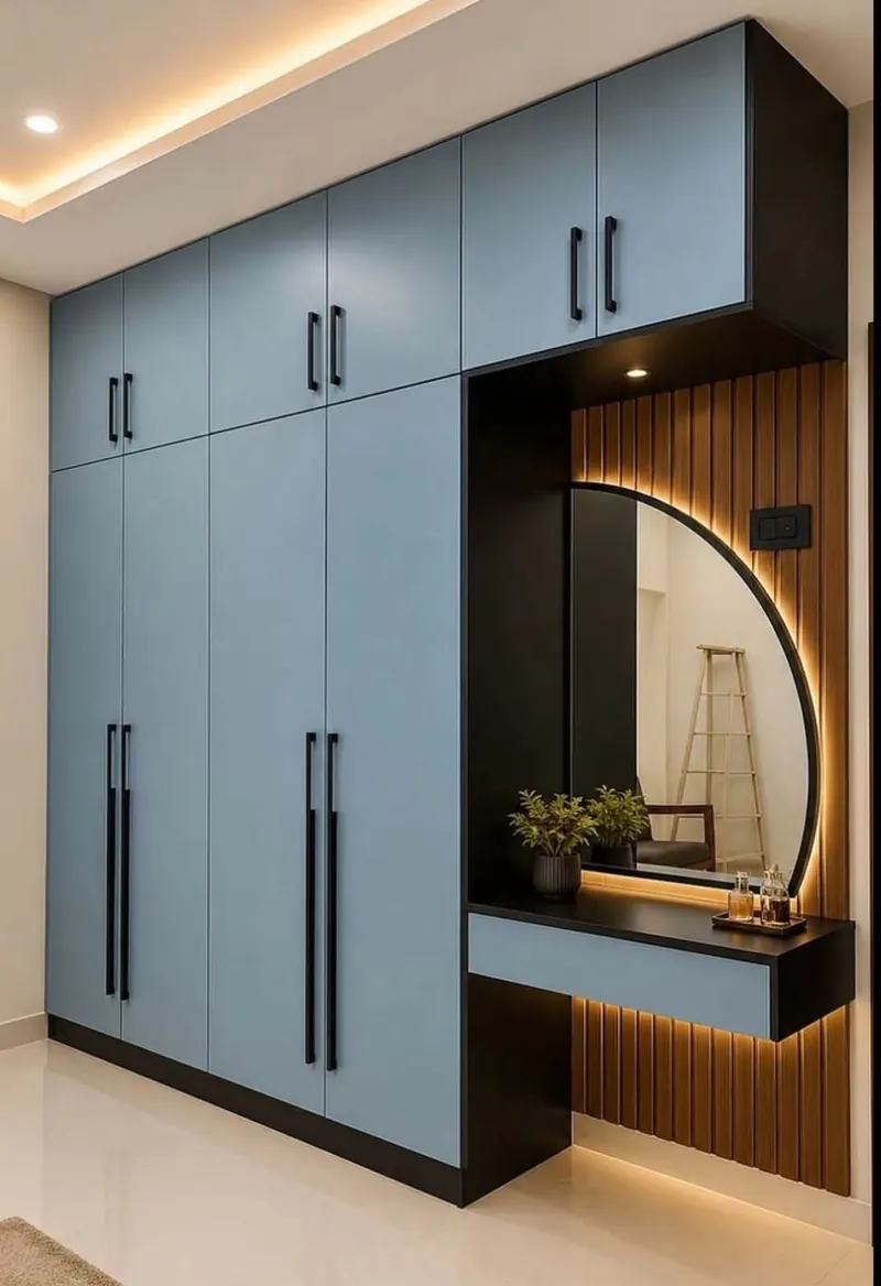 Grihala floor-to-ceiling wardrobe beside a lit mirror and dressing counter
