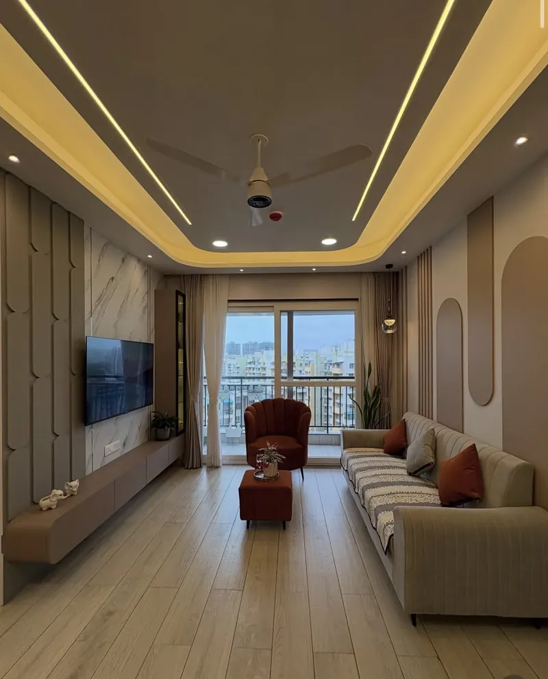 Grihala living room with TV wall, sofa, accent chair and balcony