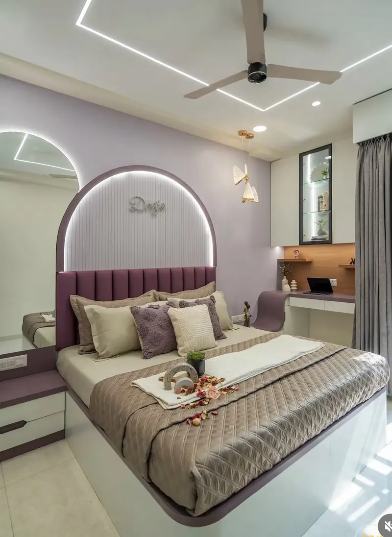 Finished Grihala bedroom with upholstered arched headboard, lighting and adjacent study